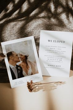 a couple kissing next to a wedding announcement