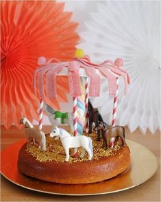 a cake decorated with horses and candy canes