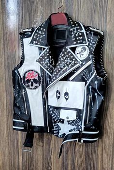 Tough Rider Biker's Wear, Men Jacket Cow Leather, Made To Hand Vest Clothing, Motorbike Studded Vest Coat, Jacket For Bachelor's Punk Rock, Pin Badges with High-Quality Studs. Each securely added by hand Cropped, Vintage-inspired / Moto / Fit Patches Jacket Steampunk Gothic 0.9 to 1.0 MM Cowhide Leather used Jacket has All sizes Available We Offer Customized Size, design, or Changes In Color Make sure to Look at the size chart below before selecting your size. If the Customer Wish we can write t Punk Rock Leather Jacket, Black Moto Biker Jacket For Alternative Fashion, Biker Leather Jacket With Rivets For Concerts, Black Rock Style Biker Jacket With Rivets, Rock Style Black Biker Jacket With Rivets, Black Biker Jacket With Rivets, Black Biker Leather Jacket For Concert, Punk Outerwear With Rivets For Biker Events, Rock Style Biker Jacket With Rivets For Biker Events