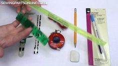 the contents of a sewing machine including scissors, tape and other items are shown in this video