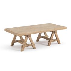 a wooden table sitting on top of a white floor