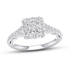 a diamond engagement ring on a white background