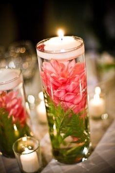 an instagram page with candles and flowers in glass vases on the left side