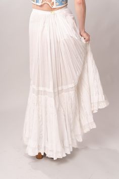 Stunning Edwardian 1910’s white cotton and lace maxi petticoat skirt. With a pretty flare silhouette, panel lace detail, and a button closure at waist. Good vintage condition, with normal wear and condition for its age. Some areas of visible mending a minor staining - see pictures. Best fits modern size XS/S Waist 26”Length 42” Featured top is the Blue Doll Quilt Corset from our friends at Psychic Outlaw. Model’s Measurements:Height 5’9”Chest 34”Waist 29”Hips 36.5” Quilt Corset, Petticoat Skirt, Kimono Coat, Visible Mending, Doll Quilt, Lace Maxi, Lace Panelled, British Indian, Petticoat