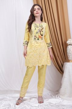 Lemon yellow straight kurta featuring lace detailing in the front with forest inspired motifs of deer, wild florals and leopard thread embroidery. Paired with a solid lace detailed pant. - Aza Fashions Fitted Cutwork Sets, Traditional Yellow Pants For Festive Occasions, Fitted Cutwork Sets For Festive Occasions, Festive Fitted Sets With Cutwork, Fitted Yellow Bottoms For Festive Season, Fitted Yellow Bottoms For Festive Occasions, Fitted Kurta With Cutwork For Spring, Fitted Cutwork Kurta For Spring, Fitted Yellow Sets With Floral Embroidery