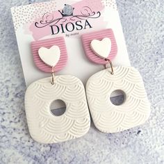 Lovers of unique style! Pair these pretty dangles with any outfit, from casual outings to a beach picnic, or a dinner date. They will be your 'go to' pair to make a unique fashion statement! Made from lightweight polymer clay and hypoallergenic posts, handmade in Australia. 5.6 cm long x 3.7 cm wide Trendy Handmade White Earrings, White Dangle Earrings For Valentine's Day, Chic White Heart-shaped Earrings, White Heart-shaped Jewelry For Summer, Handmade Heart-shaped Earrings For Her, Handmade White Heart-shaped Earrings, Handmade Heart-shaped White Earrings, Handmade Trendy Heart Drop Earrings, Handmade Everyday Earrings For Valentine's Day