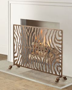 a fire place with a zebra print design on the front and back sides, in a living room