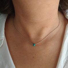 "Minimalist, wearable and delicate sterling silver necklace with turquoise beads. Length: available from 14\" (35cm) to 24\" (61cm). Width: turquoise bead 5 mm. Width 925 sterling silver chain: 0,66 mm. Strong 925 sterling silver lobster clasp. Handmade in Spain. Ideal for a gift and for combinate with other accessories. All our products are presented in a white organza bag. ♡ Made with love in Valencia ♡ ----------------------------- Discover the NICTE necklaces collection here: https://www.ets Turquoise Sterling Silver Necklace With Delicate Chain, Dainty Sterling Silver Turquoise Necklace, Dainty Turquoise Sterling Silver Necklace, Dainty Blue Turquoise Necklace In Sterling Silver, Dainty Blue Sterling Silver Turquoise Necklace, Minimalist Turquoise Necklace, Minimalist Blue Turquoise Necklace, Minimal Choker, Necklaces Collection