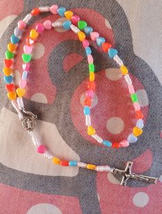 "Saint rosary made of multicolor hearts beads. Each rosary is made to order specially for you. Very light and child can worn it in any occasion. In this rosary there is hook so this rosary that you can wear it around the neck. Centerpiece is medal of Saint Benedict. Its ending with a cross which front side is the Crucified Christ, the back side has the word Medjugorje and the lower back section says, \"Mir, Mir, Mir, which is the Croatian word for Peace. Lenght rosary is 12,20 inches ( 31 cm) Be Multicolor Rosary With 8mm Beads As Gift, Handmade Multicolor Rosary As A Gift, Multicolor Handmade Rosary As Gift, Multicolor Beaded Rosary As Gift, Handmade Multicolor Rosary As Gift, Multicolor 8mm Beads Rosary As Gift, Olive Wood Cross, Saint Benedict, Catholic Rosary