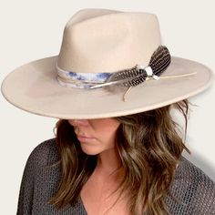 The Amelia is made from 100% Australian wool felt and has a classic wide cut brim, featuring a jute rope tie and feather trim. Details 100% Australian wool felt Brim: 3.75"Crown: 4.5"Size: O/S with a size adjuster for customizable sizing capability. The velcro ribbon size adjuster is tucked into the sweatband on the inside of the hat. How to clean: Spot clean using a damp cloth and mild soap. Air dry in an area free from direct sunlight. Bohemian Wide Brim Wool Felt Hat, Spring Adjustable Fur Felt Fedora, Adjustable Fur Felt Fedora For Spring, Spring Fedora Hat Band In Fur Felt, Adjustable Wool Hats For Spring, Adjustable Fur Felt Hat For Fall, Bohemian Wool Fedora Felt Hat, Bohemian Wool Adjustable Hat Bands, Spring Fedora Felt Hat