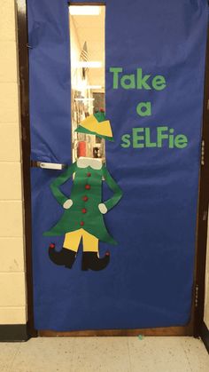 a door decorated to look like a elf with the words take a selfie on it