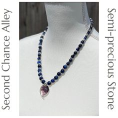 This is one of my handmade, semi-precious stone necklaces that I craft myself. Hi, I'm Ali of Second Chance Alley Designs. This particular necklace is made from 10, 8, and 6mm Dark Blue Tigers Eye semi-precious stone beads. There are Labradorite rondelle semi-precious stone spacer beads as well. There is a lampwork glass pendant in the center that draws your attention. It is spaced with elegant silver beads between each stone bead and is finished with a beautiful toggle style clasp. It measures Handmade Sodalite Round Bead Necklaces, Sodalite Gemstone Beads Necklaces, Handmade Sodalite Round Beads Necklace, Handmade Sodalite Round Bead Jewelry, Sodalite Round Beads Jewelry For Healing, Handmade Sodalite Jewelry With Round Beads, Handmade Blue Sodalite Necklaces, Lapis Lazuli Crystal Necklaces For Jewelry Making, Lapis Lazuli Crystal Necklace For Jewelry Making