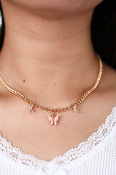 "A dainty personalized necklace featuring a colorful butterfly charm in between two crystal initials. Choose from peachy pink, turquoise blue, fuchsia pink, yellow, lavender, white, emerald green, ruby red, royal blue, jet black, and charcoal. Matching earrings: https://www.etsy.com/listing/693774042/colored-mariposa-butterfly-earrings-18k ✧ 1 gold plated necklace ✧ chain: 4mm curb (picture 2 & 5) or 3mm rolo (picture 1 & 4) ✧ lobster clasp closure ✧ nickel + lead free ✧ length: 16\"/40. Dainty Pink Butterfly Necklace For Gift, Dainty Pink Butterfly Necklace As A Gift, Dainty Pink Butterfly Necklace As Gift, Trendy Pink Jewelry With Butterfly Charm, Cute Pink Necklaces With Butterfly Charm, Trendy Pink Butterfly Charm Jewelry, Pink Butterfly Dainty Necklace, Trendy Pink Butterfly Necklace For Gift, Trendy Pink Butterfly Necklace Gift