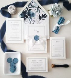 the wedding stationery is laid out and ready for guests