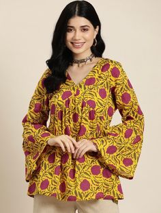 * Floral Printed Pure Cotton Kurti Printed Kurti / Embroidered Short Kurti / Indian Tunic / Summer-Spring Evening Dress / Cotton Tunic Tops Boho Tunic / Hippie Dress / Tribal Print Top * Yellow and pink a-line kurti * Floral printed * V-neck, long, bell sleeves * Machine pure cotton *Fabric:-  Pure Cotton *Wash Care:-  Machine Wash AVAILABLE IN 7 SIZES THEY ARE IN FOLLOWING MEASUREMENTS IN INCHES:- XS:- Bust-34/Waist-28/Length-32 S:- Bust-36/Waist-30/Length-32 M:- Bust-38/Waist-32/Length-32 L:- Bust-40/Waist-34/Length-32 XL:- Bust-42/Waist-36/Length-32 XXL:- Bust-44/Waist-38/Length-32 3XL:- Bust-46/Waist-40/Length-32 NOTE ►►CUSTOMISATION We do customisation ️ ►►TRACKING We give full tracking to our valuable customers, you can track your package any time with tracking code provided by our s Yellow Summer Tops With Printed Motifs, Spring Yellow Tops With Printed Motifs, Multicolor V-neck Blouse With Printed Motifs, Yellow Long Sleeve Top With Printed Motifs, Casual Yellow Kurta With Printed Motifs, Yellow Bohemian Long Sleeve Kurta, Yellow Long Sleeve Bohemian Kurta, Festive Yellow Cotton Top, Festive Yellow Long Sleeve Tops