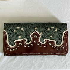 Perfect Hand Tooled Leather Wallet Gorgeous Green Black And White Tri Color Silver Tone Studs Floral Leaf Designs Aw Initials Inner Cotton Fabric Tan Stitching Measuring 7”1/2” X 4” Leather Clutch With Snap Closure And Rectangular Shape, Leather Bifold Bag With Snap Closure, Leather Clutch Wallet With Snap Closure, Snap Closure Rectangular Leather Wallet, Elegant Hand Tooled Leather Wallets, Leather Wallet With Snap Closure, Rectangular Leather Wallet With Snap Closure, Leather Wallets With Snap Closure For Daily Use, Green Leather Clutch With Card Slots