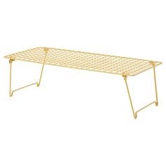 a gold metal shelf with two legs