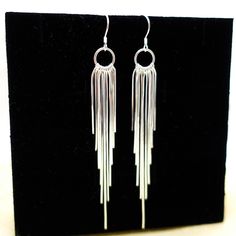 Shinny tassel earrings made by 925 sterling silver , with 11 strings of tassels each, they are just Absolutely Stunning. Perfect for everyday and special occasions . One of my Customers said they are like " flowing silver river"  . For Matching Necklace please go: https://www.etsy.com/listing/1453303841/tassel-necklace-sterling-silver-long?click_key=411a8703bb3458c8fddd241b95e632a9e5ec40cd%3A1453303841&click_sum=4f8f71ce&ref=shop_home_active_1&pro=1&frs=1&sts=1 Return to the home page, click here : https://www.etsy.com/shop/tibicollection Party Sterling Silver Dangle Bridal Earrings, Sterling Silver Dangle Bridal Earrings For Party, Party Bridal Dangle Earrings In Sterling Silver, Sterling Silver Pierced Chandelier Earrings For Party, Dangle Tassel Earrings For Celebration, Sterling Silver Dangle Earrings For Party, Sterling Silver Chandelier Earrings For Party, Evening Dangle Hoop Earrings With Ear Wire, Sterling Silver Dangle Chandelier Earrings For Party