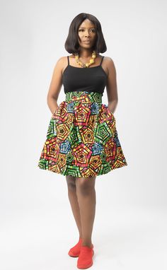 Embrace the boldness and beauty of African fashion with this exquisite skirt that seamlessly blends tradition with modern style. FEATURES: - Main colours: Red/ Yellow/ Black/ Green - Multi-coloured - Comfortable fit - Synched waist/High - Above knee length - A-line skirt - Ankara print/ 100% cotton - wax cotton fabric Multicolor Full Skirt Dress With Gathered Detail, Multicolor Full Dress With Gathered Skirt, Fitted Multicolor Long Skirt, Green A-line Pleated Skirt, Fitted Multicolor Lined Maxi Skirt, Multicolor Long Flowy Skirt Dress, Multicolor Flowy Flared Dress, Green A-line Gathered Skirt, Multicolor Long Lined Wrap Skirt