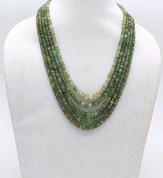 AAA Quality Natural Faceted Heishi 5 Strand Emerald Necklace With Adjustable Tassel Cord(Sarafa), 5 Strand Necklace, Natural Emerald Necklace, 18 Inch Long Specifics: Material : Gemstone Length: 18 Inch Necklace Stone :  Natural Emerald Gemstone Stone Size :  5.5 mm X 6.9 mm -- 7.8 mm X 9.6 mm Style:  Faceted Beaded Necklace Color: Green We deal in all kind of semi precious,precious beads ,Gemstones and Jewelry (in every shape and size ) as per demand. Here, you get a direct access to an exclusi Cheap Green Multi-strand Necklaces, Luxury Green Multi-strand Beaded Necklaces, Luxury Double Strand Green Necklace, Luxury Green Single Strand Beaded Necklace, Necklace Emerald, Necklace Stone, Gold Jewelry Earrings, Precious Beads, Emerald Necklace