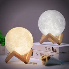 the moon lamp is next to a teddy bear