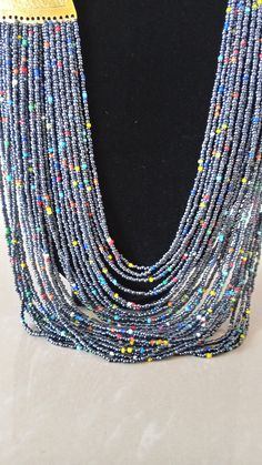 African beaded necklaces, African Masai Jewelry, Beaded Jewelry for women, Gift for her, Tribal necklace, Moms Gift, Multi-strand necklace This layering statement necklace is superbly crafted. Main Color - Gray. Available in different colors. Feel free to send me a convo or e-mail for any clarification or more information. Thank you for visiting and happy shopping! Colorful Beads Multi-strand Bib Necklaces For Jewelry Making, Colorful Beads Multi-strand Bib Necklace For Jewelry Making, Silver Beaded Necklaces With Colorful Beads As Costume Jewelry, Silver Beaded Necklaces With Colorful Beads For Costume Jewelry, Silver Beaded Necklace With Colorful Beads For Costumes, Costume Jewelry Silver Beaded Necklaces With Colorful Beads, Silver Costume Jewelry Beaded Necklaces With Colorful Beads, Double Strand Beaded Costume Necklaces, Costume Jewelry Double Strand Beaded Necklaces