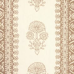 a brown and white rug with flowers on the bottom, two rows of lines in the middle