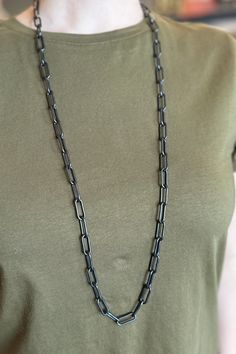 The black finish on this classic paperclip chain gives it a unique flair. Add it to your office look for a touch of sophistication. Lobster Claw Clasp. Length: 18" Black Box Chain Necklace For Formal Occasions, Black Box Chain Necklace For Formal Events, Black Chain Jewelry For Everyday Use, Everyday Black Chain Link Necklace, Formal Black Box Chain Necklace, Minimalist Black Cable Chain Necklace, Black Necklace With Adjustable Chain For Everyday Use, Everyday Black Box Chain Necklace, Black Adjustable Chain Necklace For Everyday