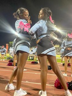 the cheerleaders are performing on the field