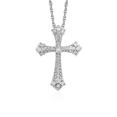 The shine of diamonds adds depth and beauty to this elegant Gothic style cross pendant in sterling silver. The pendant is 18 inches long and closes with a lobster clasp. Pendant Information Chain Length 18 inches Item Width 0.75 inches Item Height 1.00 inches Chain Type Cable Clasp Type Lobster Clasp Setting Type Prongs Rhodium Polish Yes Avaliable Sizes 18 Metal 925 Sterling Silver Diamond Information Min ct. tw. 0.04 Shape Round Average Color J Average Clarity I2 Ring Size Number Of Diamonds T Cheap Silver Rings, Gothic Cross, Silver Ring Designs, Elegant Gothic, Sterling Silver Rings Set, Diamond Cross Pendants, Cross Jewelry, Gothic Style, Sterling Silver Cross