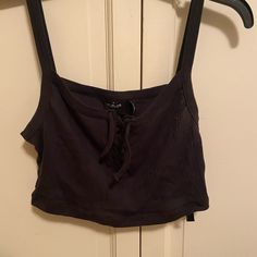 Black Uo Crop Top. Ties In Front, Never Worn. Size L Urban Outfitters Sleeveless Black Crop Top, Urban Outfitters Black Tank Top For Spring, Black Cotton Tank Top For Day Out, Urban Outfitters Black Crop Top For Summer, Urban Outfitters Black Casual Crop Top, Black Urban Outfitters Crop Top For Summer, Urban Outfitters Black Cropped Crop Top, Urban Outfitters Fitted Black Tank Top, Urban Outfitters Black Cropped Top