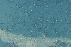 an old map with many stars in the sky and clouds on it's surface