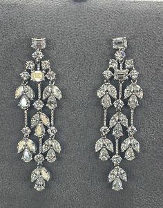 Luxury Diamond Chandelier Earrings, Luxury Crystal Chandelier Earrings With Sparkling Stones, Luxury Chandelier Earrings For Formal Occasions, Luxury Crystal Embellished Earrings For Formal Occasions, Luxury Diamond White Chandelier Earrings, Luxury Cubic Zirconia Chandelier Earrings, Luxury Earrings For Receptions, Luxury Earrings For Reception, Luxury Brilliant Cut Chandelier Earrings For Evening