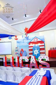 an image of a baby shower party with red, white and blue decorations on the ceiling