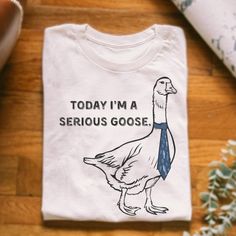 Today I_m A Serious Goose Tshirt, What_s Up Brother Shirt Discover The Latest Additions To Our Lineup: The Gildan 5000 T-Shirts, Where Style Seamlessly Meets Unparalleled Comfort! Designed To Cater To A Wide Range Of Preferences, These Shirts Are Available In Sizes Ranging From S To 3xl, Ensuring A Perfect Fit For Everyone. With A Vibrant Array Of Colors To Choose From, You Can Express Yourself However You Like. Crafted With Durability In Mind, These Shirts Maintain Their Shape And Color, Even A Funny Gender Neutral Gifts, Tshirt Words Ideas, Funky Shirts, Fun Shirts, Brother Shirts, Funny T Shirts, Funny Tees, Satire, Funny T