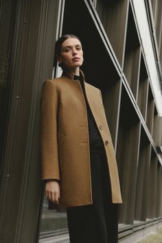 Introducing our sophisticated dark camel short wool coat--an elevated addition to your outerwear collection. With its stylish stand collar and flattering H-silhouette, this coat exudes timeless elegance. Crafted from high-quality wool, it ensures both warmth and style, making it perfect for the colder months. The regular fit provides a comfortable and flattering silhouette that complements every body type. Whether you're dressing up for a special occasion or adding polish to your everyday look, Elegant Brown Merino Wool Outerwear, Camel Wool Outerwear With Lapel Collar, Wedding Skirt Top, Luxury Camel Wool Coat, Caramel Coat, Silk Bridal Gown, Stand Collar Coat, Brown Double-breasted Wool Outerwear, Brown Wool Single-breasted Outerwear