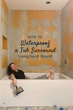 a man laying in a bathtub with the words how to waterproof a tub surround using kerdi board