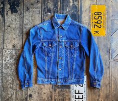 Vintage Rare 1960/70s Levi's Type 3 Big E Indigo Trucker Jacket, Soft and Faded, Button Stamp 524, Made In USA   Size: Medium. Wear: Very good condition. (One small hole right shoulder)  Pit to pit: 20 Inch Collar to hem (on back of item): 23 Inch  Arm: 25 Inch We lovingly hand pick every vintage item for its age, uniqueness, coolness and style.  Hope you like our finds. All of our items are vintage and may show signs of previous wear. Any significant wear, damage or marks will be photographed h Retro Pre-washed Outerwear For Fall, Retro Medium Wash Outerwear With Button Closure, Vintage Denim Jacket With Snap Buttons For Spring, Vintage Denim Jacket With Buttons For Winter, Vintage Winter Denim Jacket With Buttons, Vintage Denim Jacket For Winter, Vintage Single Breasted Denim Jacket For Fall, Vintage Medium Wash Long Sleeve Outerwear, Vintage Button-up Denim Jacket For Fall