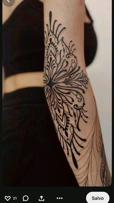 a woman's arm with an intricate tattoo design on the left side of her arm