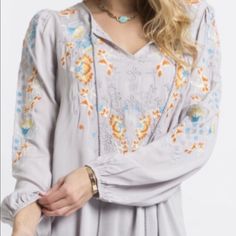 Long Sleeve Blouse With Floral Embroidered Detailing On Front Loose Fit , Woven Relaxed 100 % Rayon First Photo Is Closest To The Correct Color. Embroidered Long Sleeve Blouse For Brunch, Long Sleeve Embroidered Blouse For Brunch, Spring Tunic Top With Intricate Embroidery, Fall Floral Embroidery Tunic Blouse, Fall Floral Embroidered Tunic Blouse, Flowy Long Sleeve Blouse With Floral Embroidery, Spring Long Sleeve Blouse With Tonal Embroidery, Bohemian Spring Tops With Tonal Embroidery, Spring Bohemian Tops With Tonal Embroidery