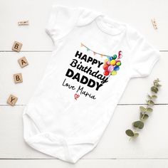 A personalized baby bodysuit with the design name "Happy Birthday Mommy or Daddy" is a charming and heartwarming gift to celebrate a special occasion for a new parent. Made from soft and comfortable cotton material, this bodysuit is perfect for newborns and infants up to 24 months old. The design features a sweet message of "Happy Birthday Mommy or Daddy" printed in bold and vibrant colors, making it a standout piece in any baby's wardrobe. The text is surrounded by fun and playful illustrations Personalized Fitted Onesie For Birthday, Birthday Fitted Letter Print Bodysuit, Customizable Cotton Onesie For First Birthday, Playful Short Sleeve Bodysuit For Birthday, Personalized White Onesie As A Gift, Personalized White Bodysuit For Gift, Personalized White Onesie As Gift, Cotton Birthday Onesie For Father's Day, Birthday Cotton Onesie With Letter Print