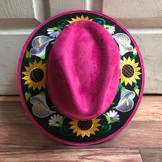 Stand out with this beautiful handcrafted Mexican Suede Hat with beautiful detailed floral embroidered canvas brim. Perfect accessory to add that with that daily outfit. MADE IN MEXICO By: Mexican Artisans For: Women Size: Medium 23' Color: magenta | multi Details: Top Suede Embroidered canvas brim Inner elastic band Contact us for more details PLEASE READ BEFORE PURCHASE: The picture is an ACCURATE REPRESENTATION.Colors in the pictures may vary a little by effects of light. Each product is hand Embroidered Fitted Cap, Traditional Wide Brim Fitted Hat, Traditional Fitted Wide Brim Hat, Spring Festival Costume Hat With Short Brim, Pink Embroidered Hats With Curved Brim, Pink Embroidered Hat With Curved Brim, Handmade Adjustable Hat With Multicolor Embroidery, Spring Embroidered Fedora Hat, Western Style Embroidered Flat Brim Hat