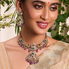 Description: Indulge in the vintage elegance of the Yasmin hasli necklace set. Inspired by India's rich jewelry heritage, it features opulent Moissanite stones, nakshi motifs, and a central peacock motif surrounded with bird and floral patterns. Crafted in 925 silvers with Victorian plating, sapphire beads, and cluster pearl drops, it exudes vintage charm. Product Information: Metal: 925 Silver with Victorian Plating Length: Necklace- 18cm, Earrings- 7cm Stones: High Grade CZ Stones Findings: Ho Temple Jewelry Sets With 17 Jewels For Reception, Ornate Chandbali Jewelry With 17 Jewels, Kundan Chandbali Temple Necklace For Formal Events, Kundan Chandbali Temple Necklace For Formal Occasions, Formal Kundan Chandbali Temple Necklace, Chandbali Temple Necklace For Formal Occasions, Formal Chandbali Temple Necklace, Temple Jewelry Sets For Reception And Diwali, Ornate Hand Set Chandbali Kundan Necklace