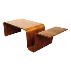 two wooden tables sitting next to each other