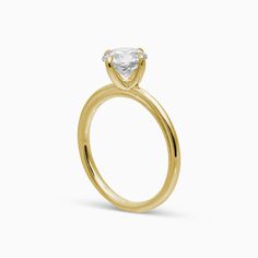 The Sage Engagement Ring is dainty yet modern with single claw prongs set in a compass orientation. This is the perfect unique twist to a traditional solitaire. This ring can be set with any size or shape of center stone and is available in 14k or 18k yellow gold, white gold, rose gold or platinum. Have more questions or want to try it on? Book an appointment to sit down with one of our bridal experts virtually or in-store. Pepper Band, Bezel Necklace, Bespoke Engagement Ring, A Compass, Claw Prong, Twist Ring, Jewelry Studio, Signature Jewelry, Grey Diamond