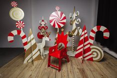 a group of wooden christmas decorations sitting on top of a wooden floor