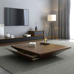 a living room scene with focus on the coffee table and large storage unit in the background