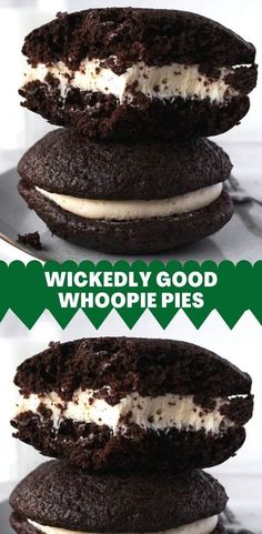 three chocolate cookies with white frosting stacked on top of each other