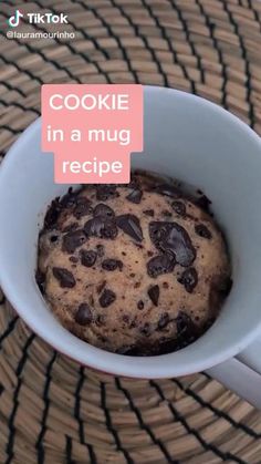 there is a cookie in a mug on the table