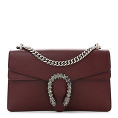 This is an authentic GUCCI Dollar Calfskin Crystal Small Dionysus Shoulder Bag in Vintage Bordeaux. This stylish bag is crafted oftextured calfskin leather in burgundy. The bag features an aged silver chain shoulder strap, and a textured and crystal gem encrusted horseshoe closure with lion heads at the end. This opens to a beige fabricinterior with a central zipper pocket. Gucci Brown Soft Leather Shoulder Bag, Gucci Soft Leather Brown Shoulder Bag, Brown Soft Leather Gucci Shoulder Bag, Gucci Soft Leather Rectangular Shoulder Bag, Gucci Soft Leather Crossbody Bag, Gucci Soft Leather Bag For Formal Occasions, Luxury Burgundy Crossbody Bag, Gucci Evening Bags With Leather Lining, Luxury Burgundy Bags With Silver-tone Hardware